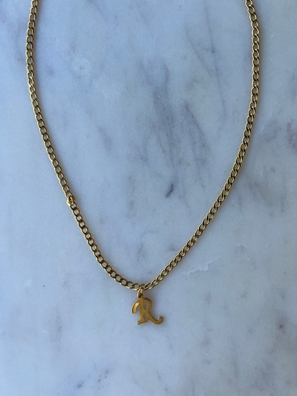 Initial letter in gold link chain