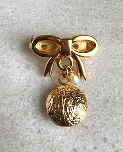 Gold religious pin